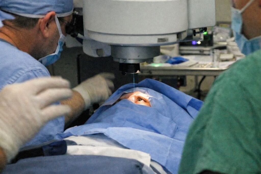 An illustrative medical snapshot taken casually from the foot of the operating bed during LASIK laser eye surgery