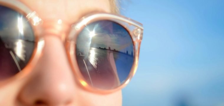 a photo of a person wearing sunglasses on summer holiday