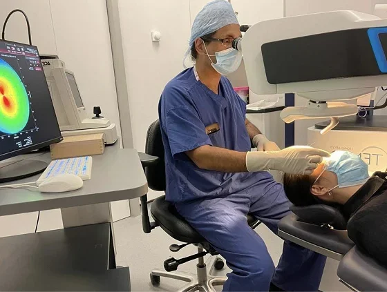 Mr Mukherjee treating a patient at the laser in Colchester.